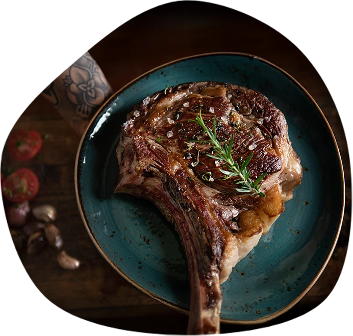 a piece of meat on a blue plate