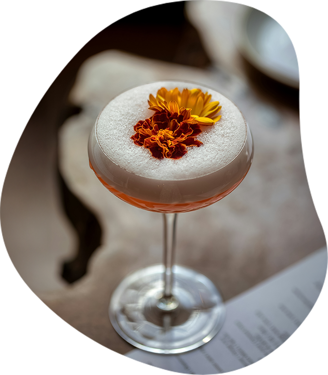 a glass with a flower on top