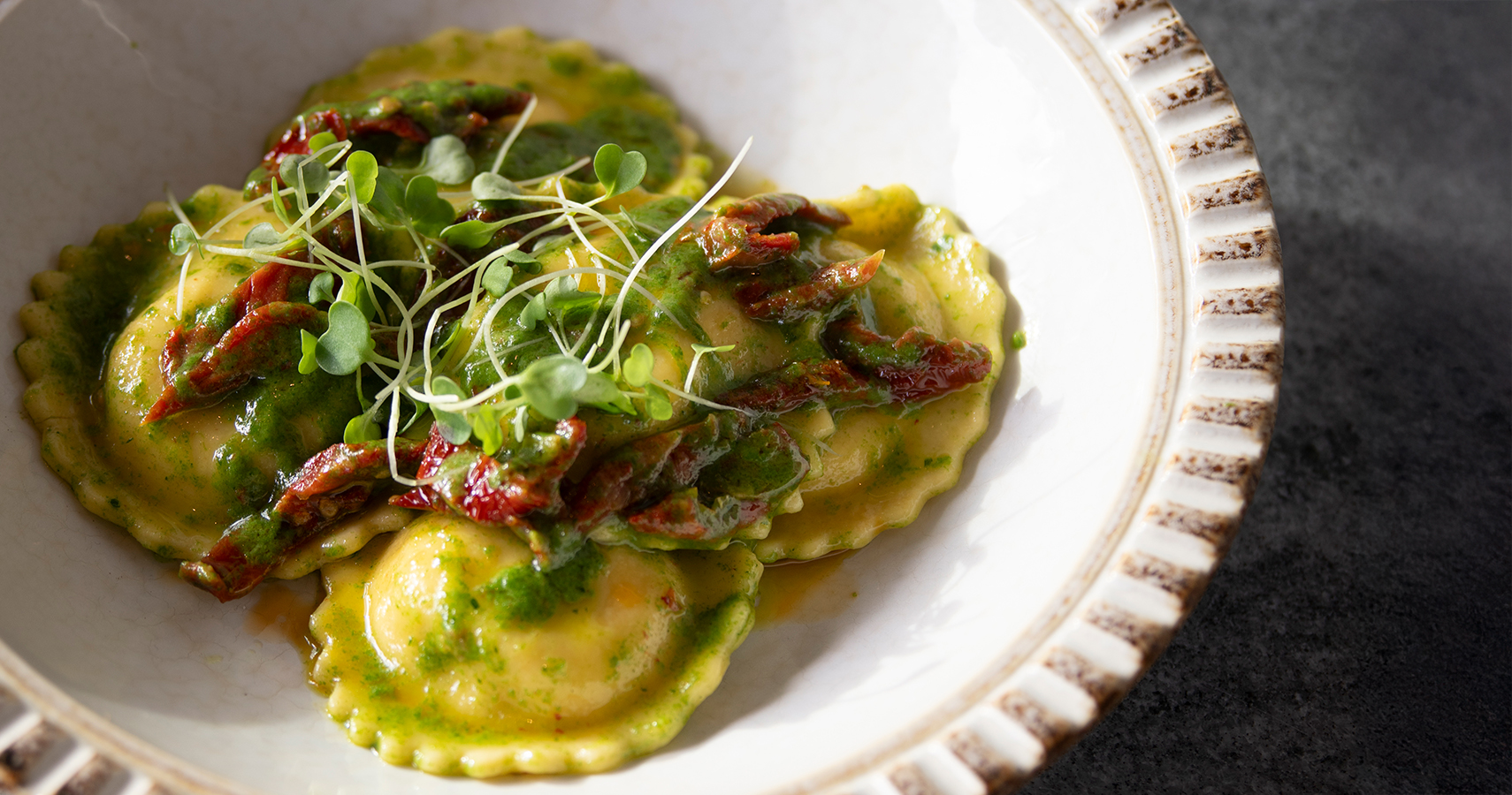 a plate of food with greens on it