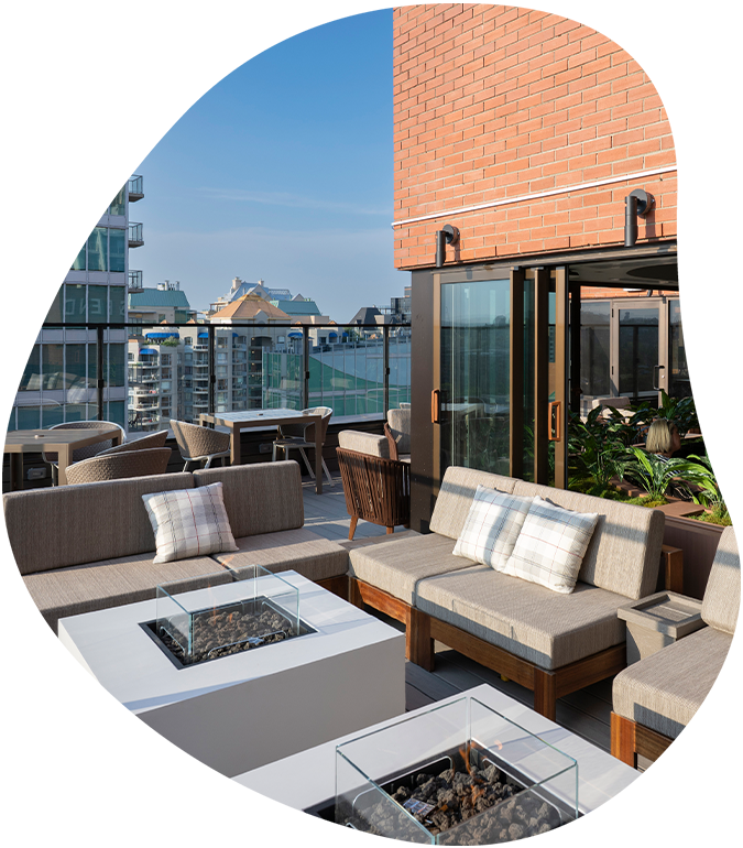 a patio with furniture and a fire pit