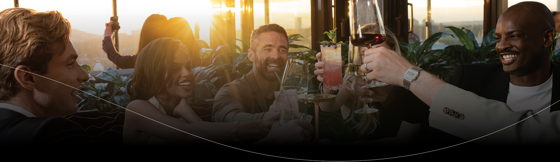 a group of people holding drinks