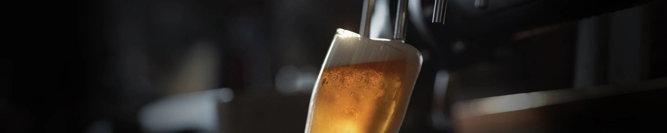 a close up of a glass of beer