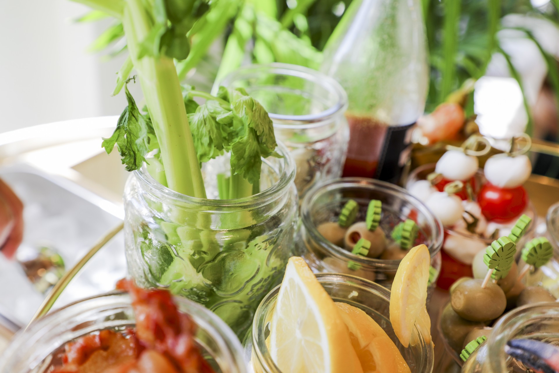 a group of jars with food in them