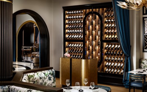 a wine wall with wine bottles and glasses