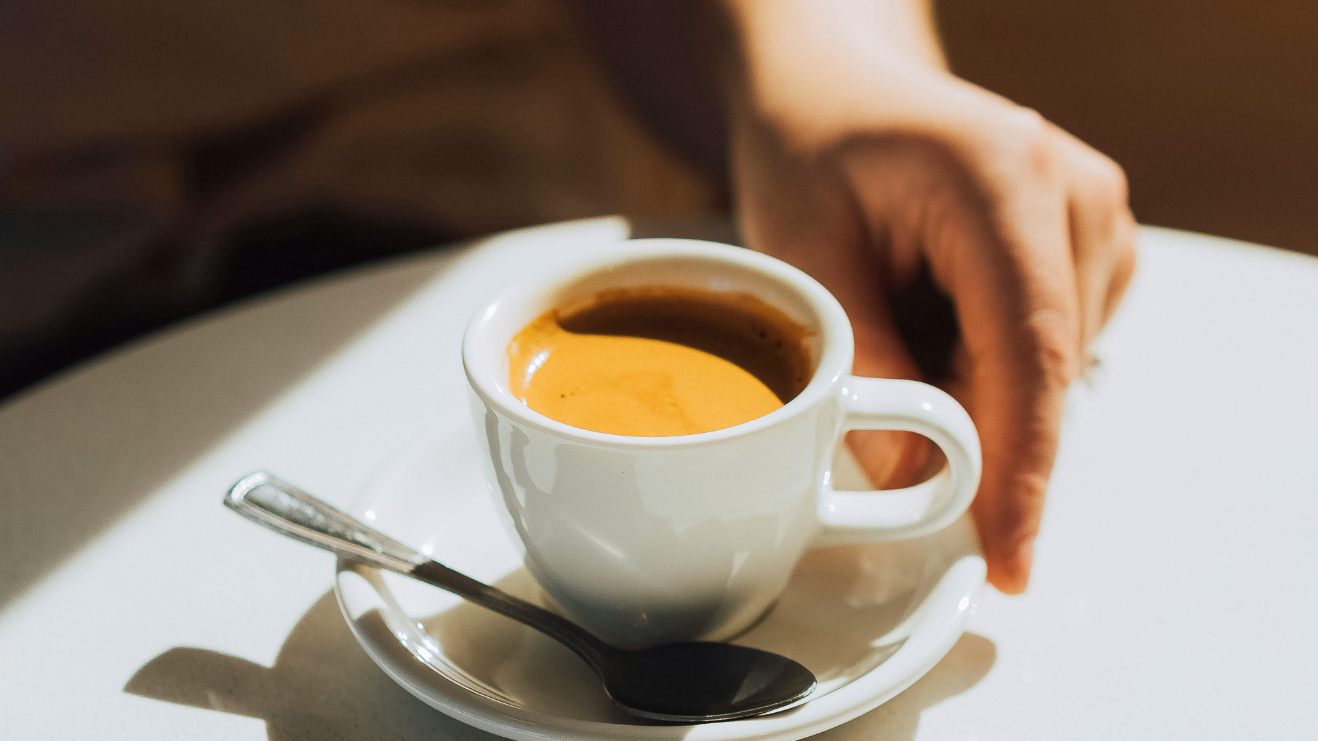 a cup of coffee with a spoon