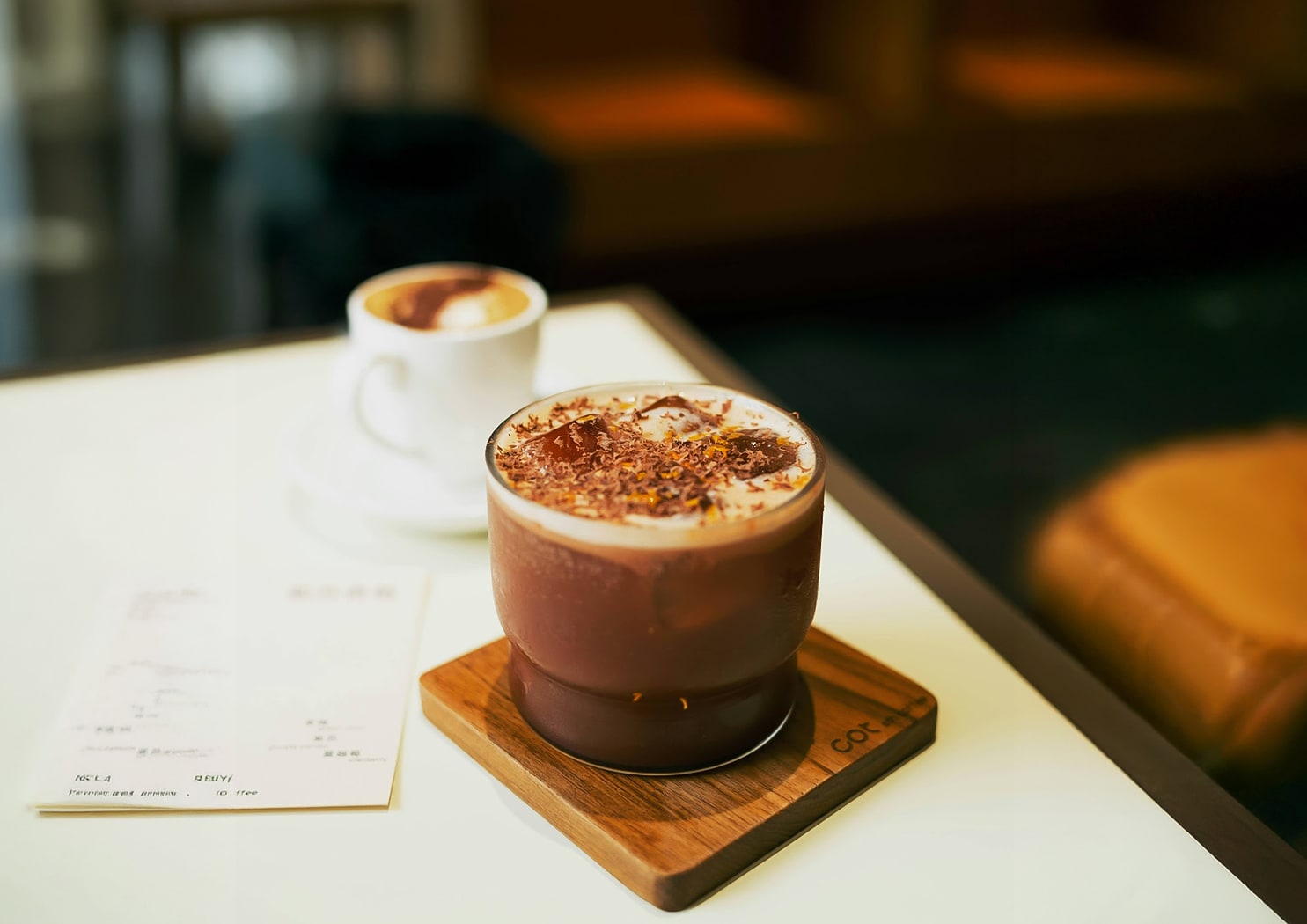 a cup of coffee and a menu