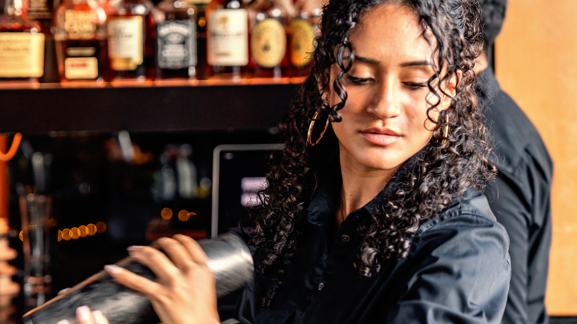 a woman holding a shaker