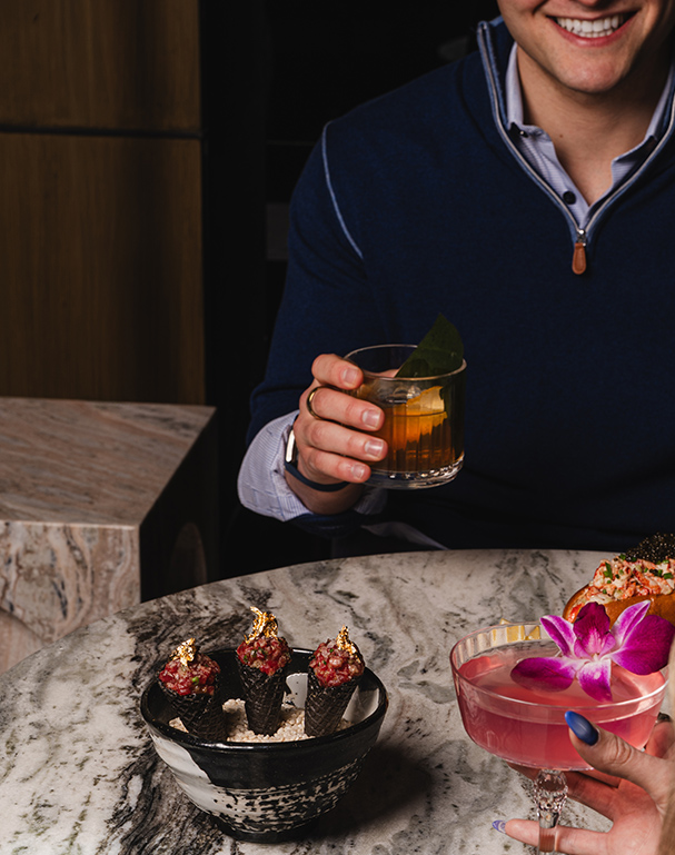 a man holding a drink