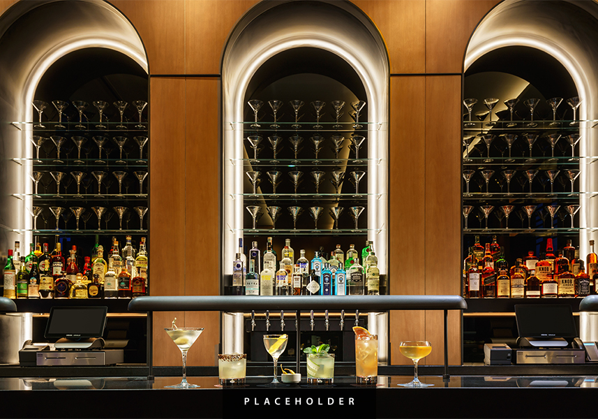 a bar with many glasses of alcohol