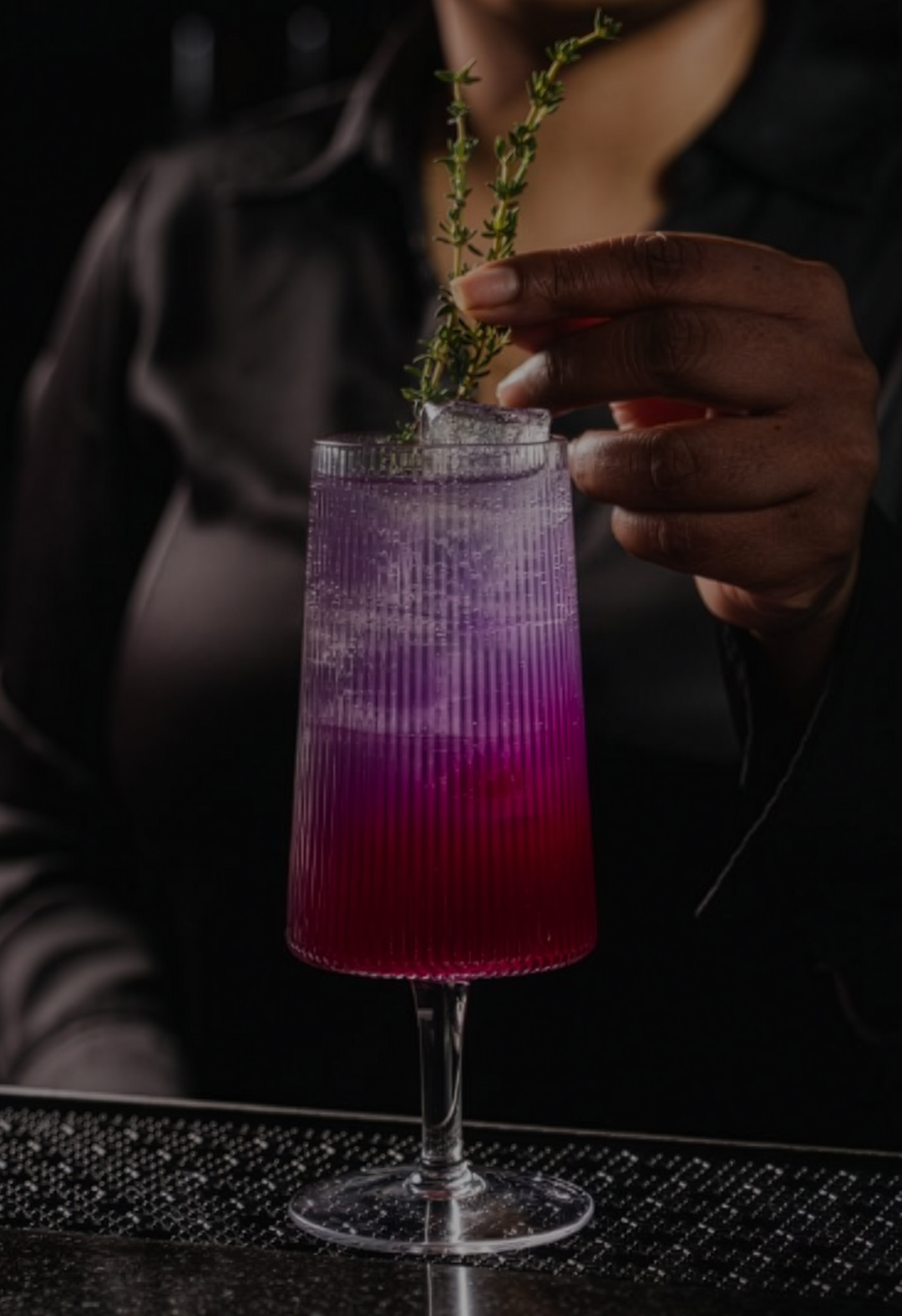 a person holding a drink