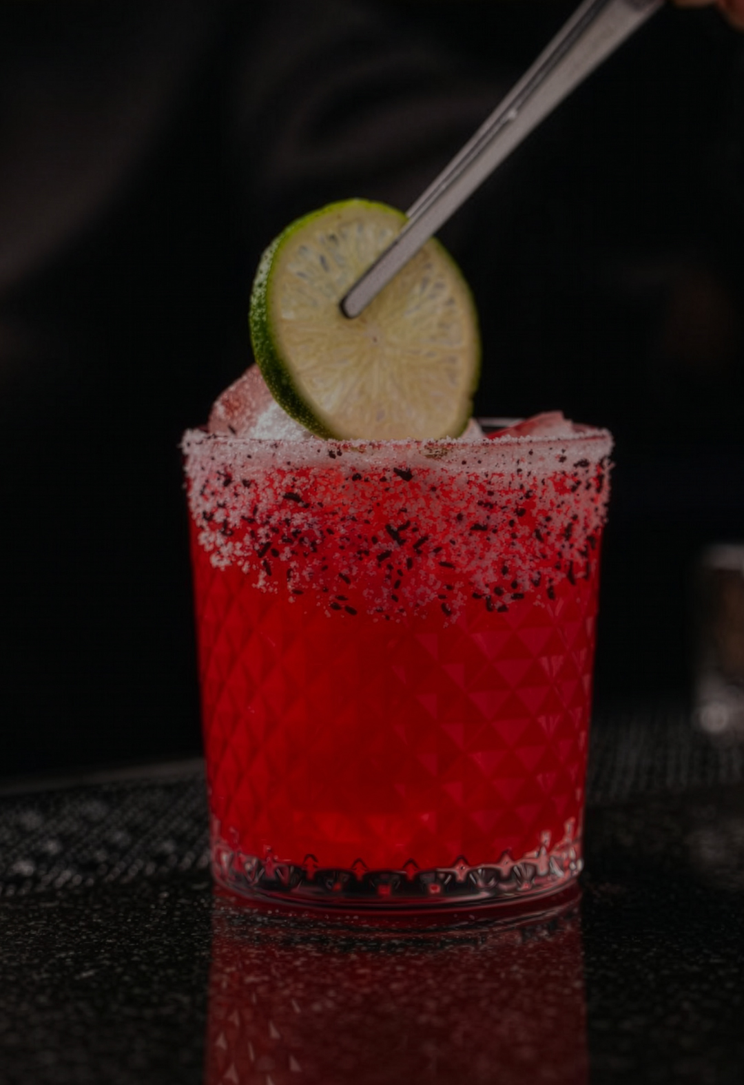 a glass with a drink and a straw