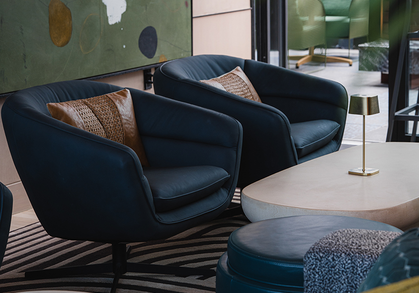 a two chairs next to a table