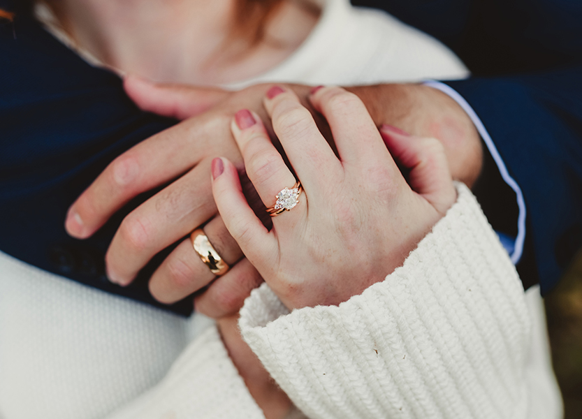 a close up of hands with rings