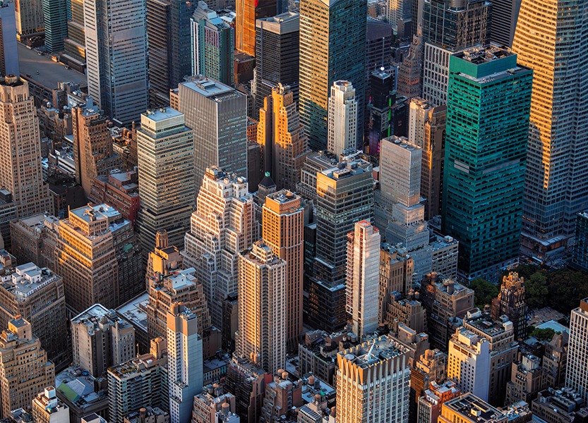 a city skyline with many tall buildings