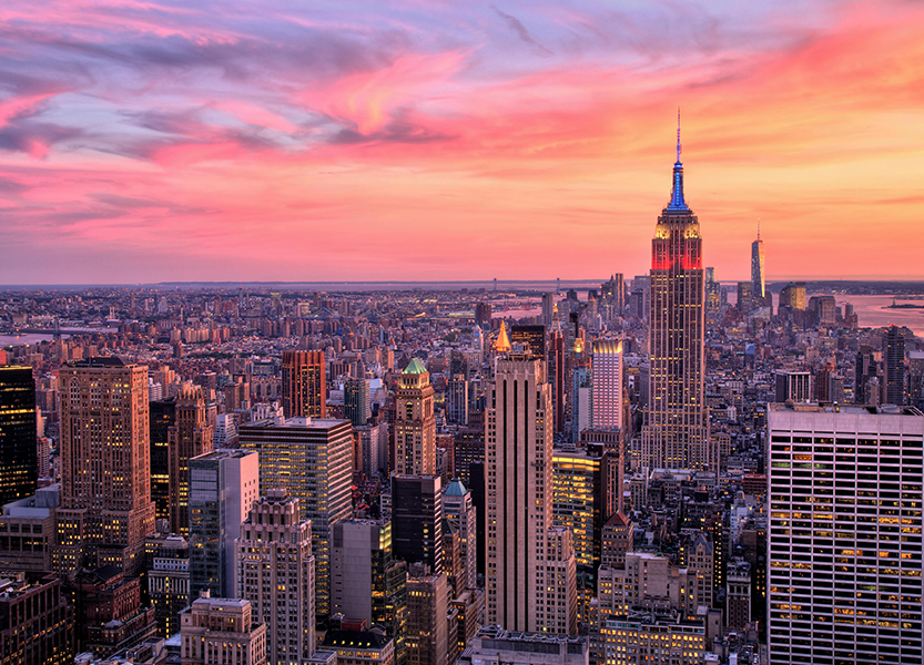 a city skyline with many tall buildings