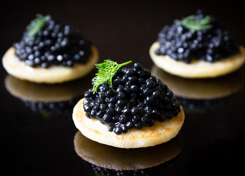 a group of black food on a black surface