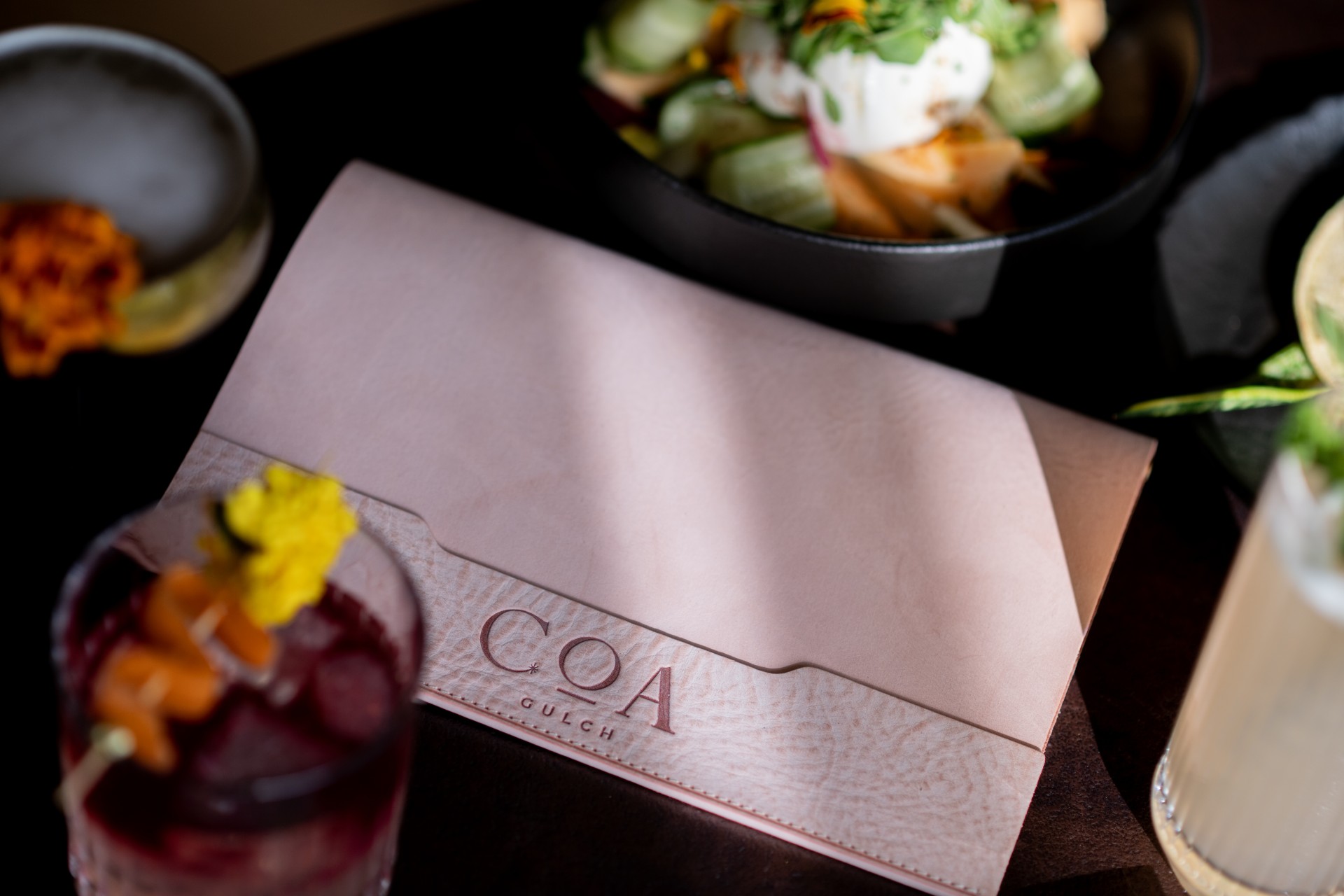 a pink folder with a plate of food in it
