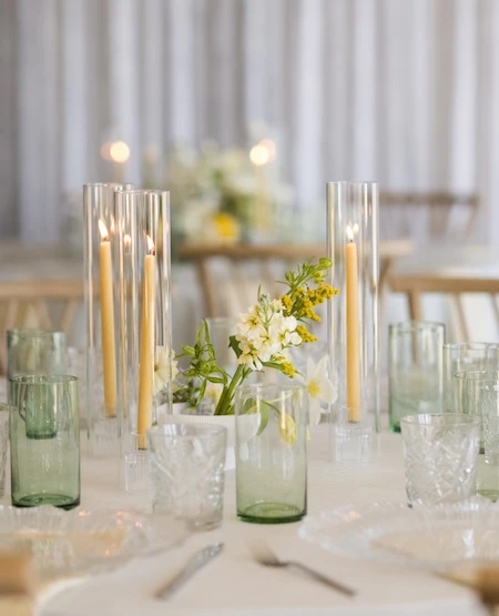 a table with candles and flowers