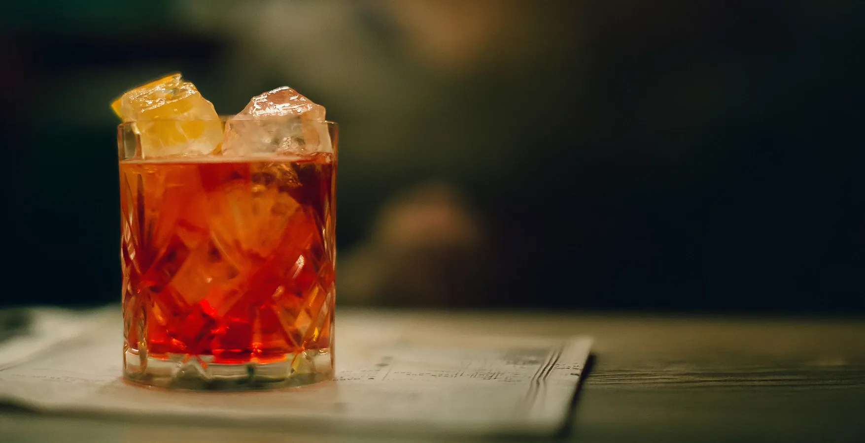 a glass with a drink and ice