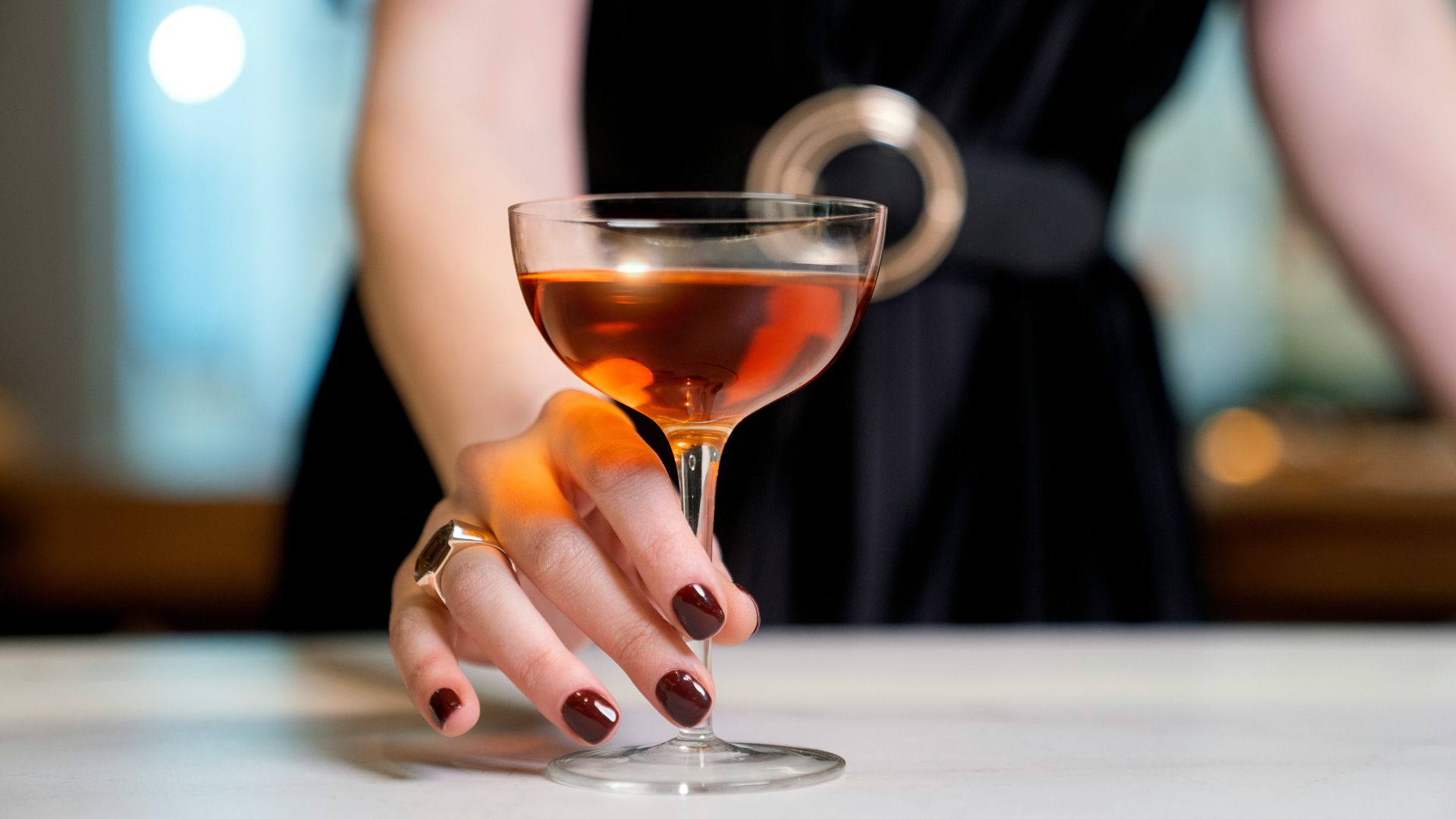 a hand with a wine glass