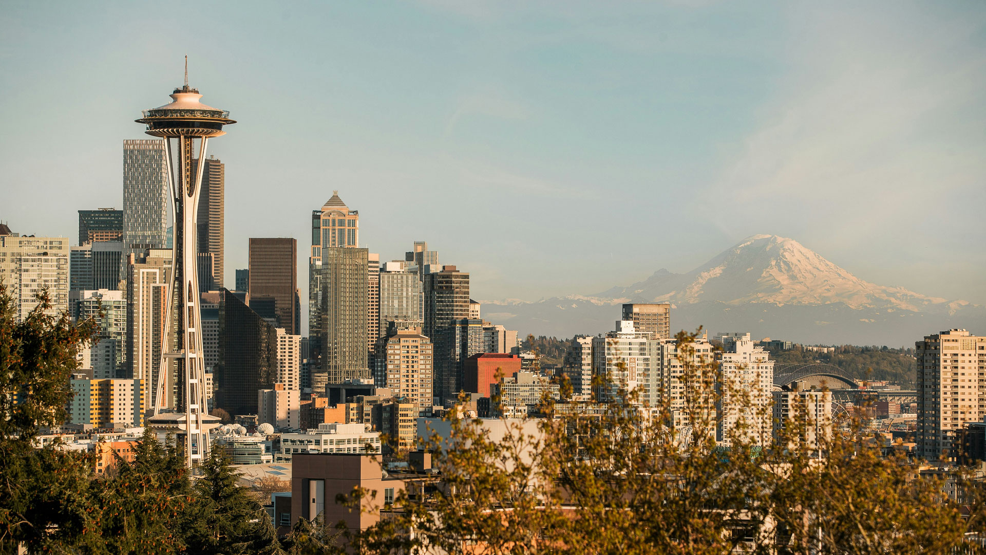 Space Needle with a mountain in the background