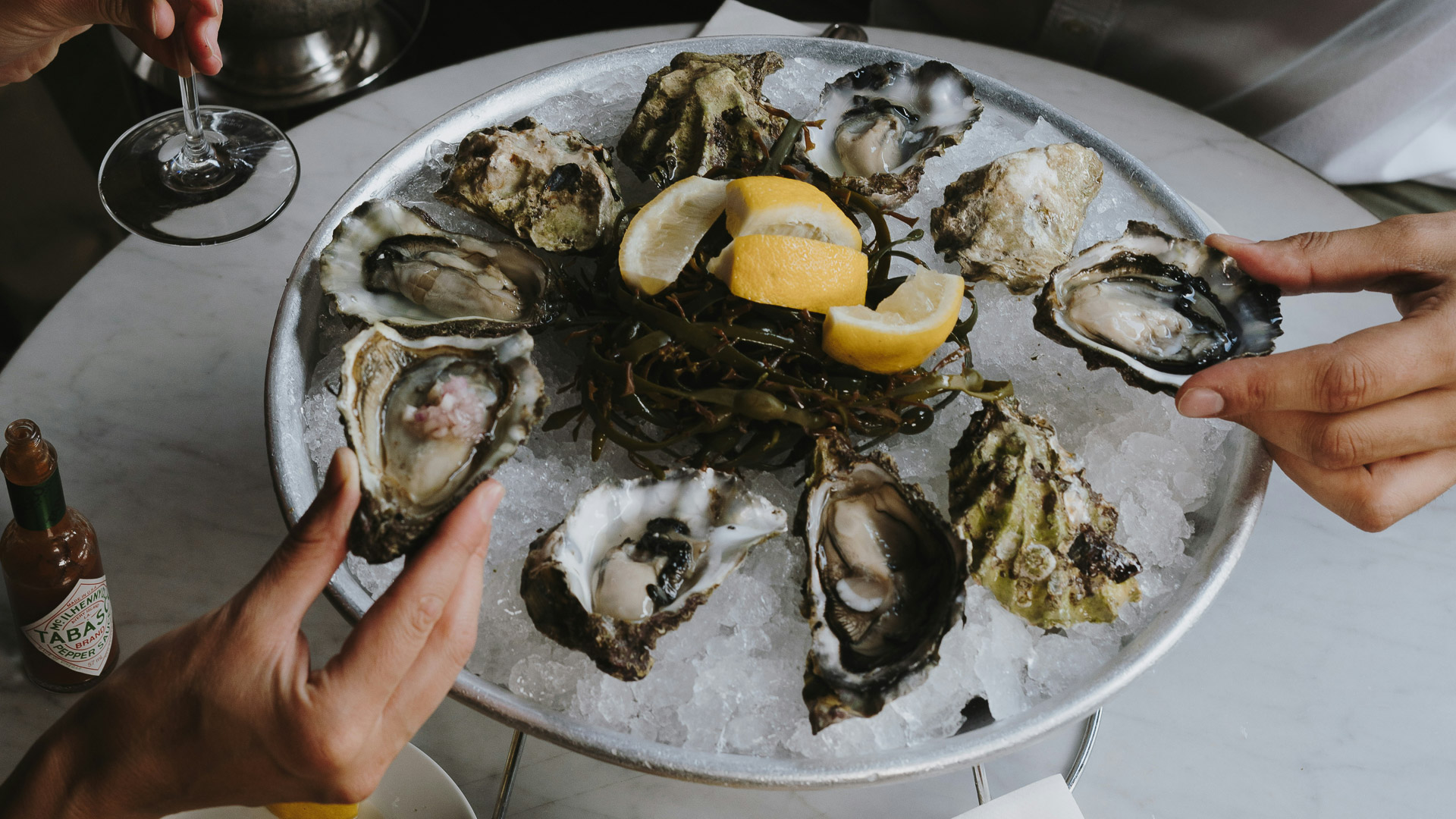 a plate of oysters and lemons