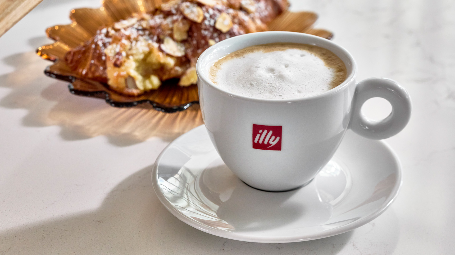 a cup of coffee and a pastry