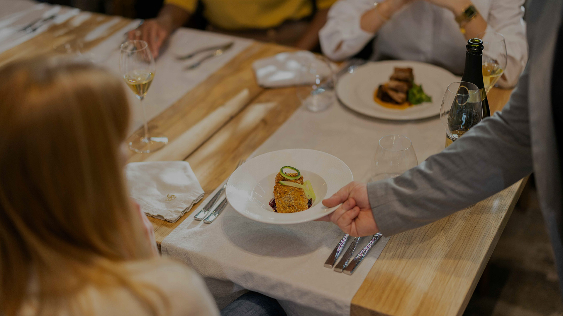 a person holding a plate of food