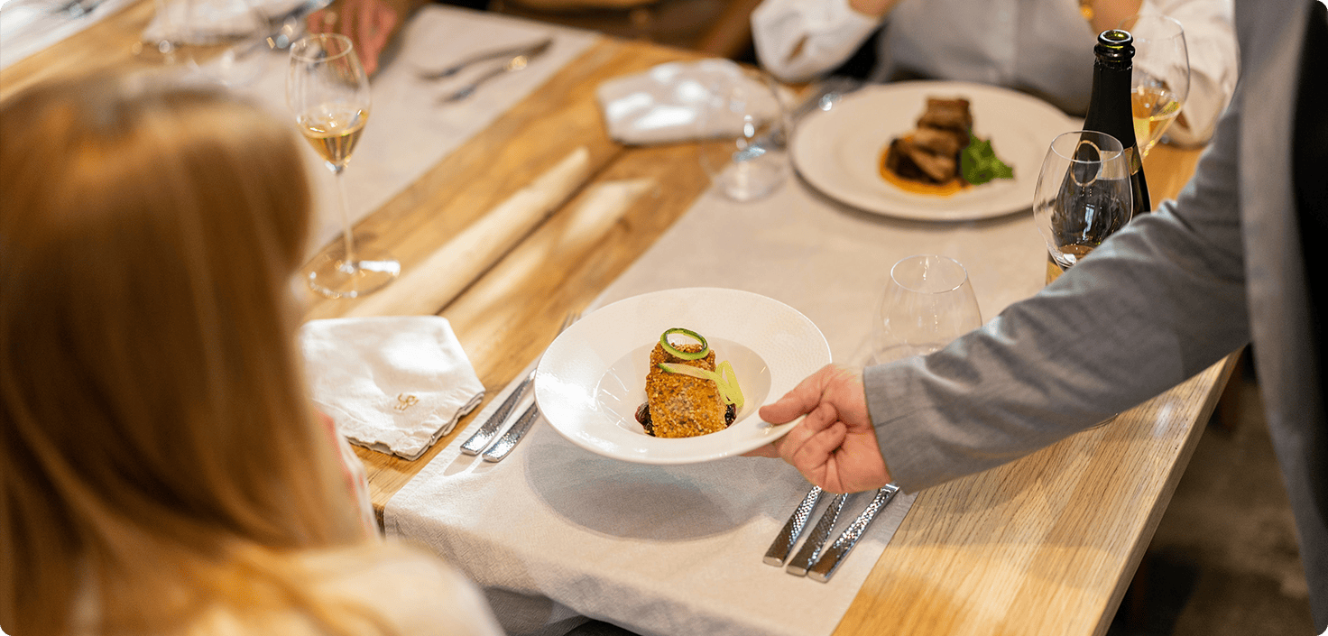 a person holding a plate of food
