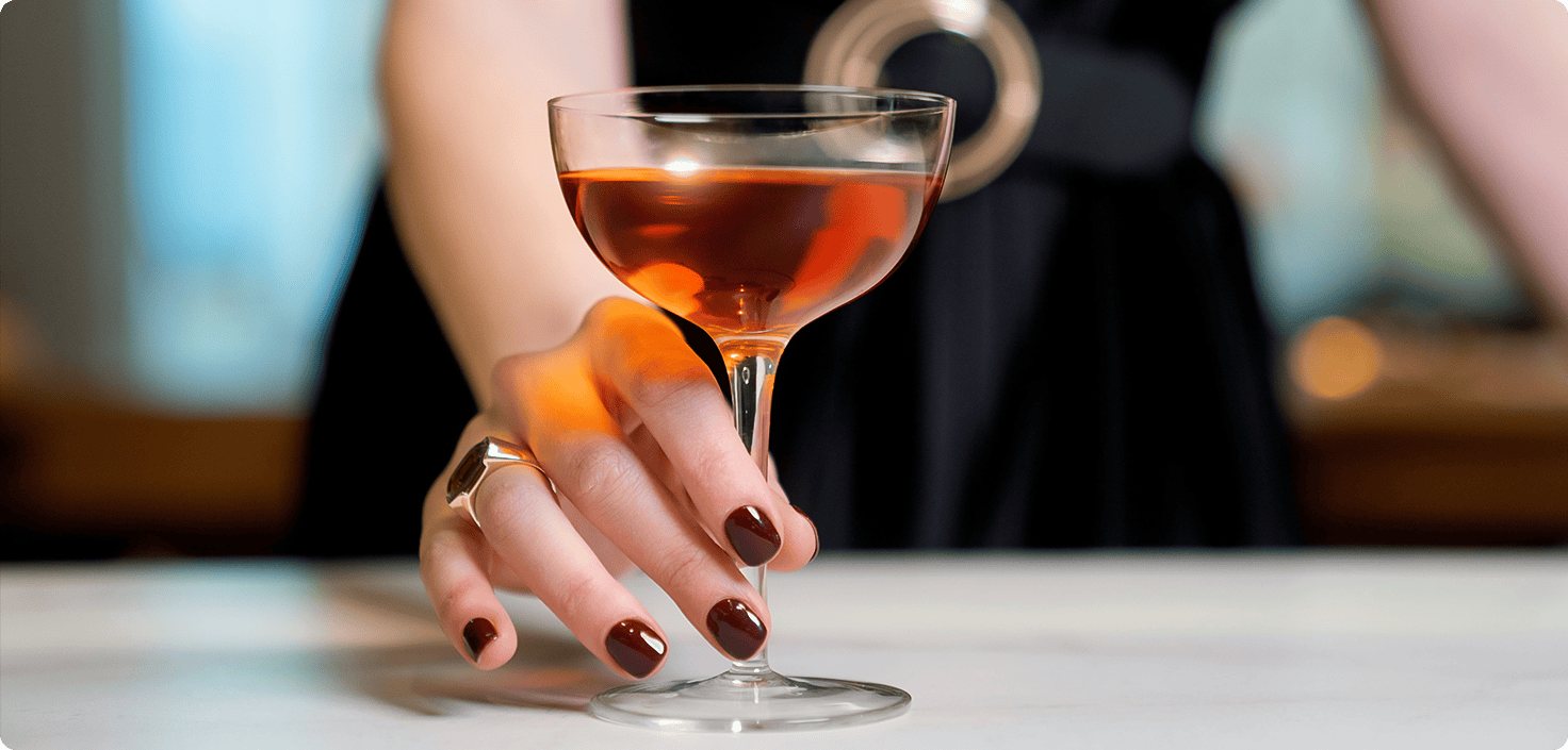 a hand with a wine glass