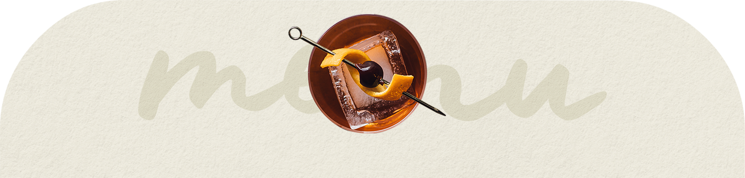 a cocktail with a fruit on a stick