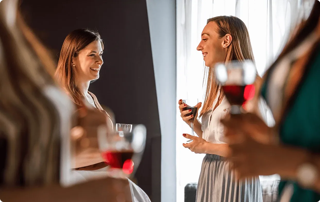 a group of women holding wine glasses