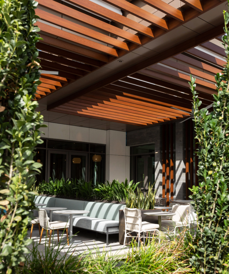 a patio with chairs and tables