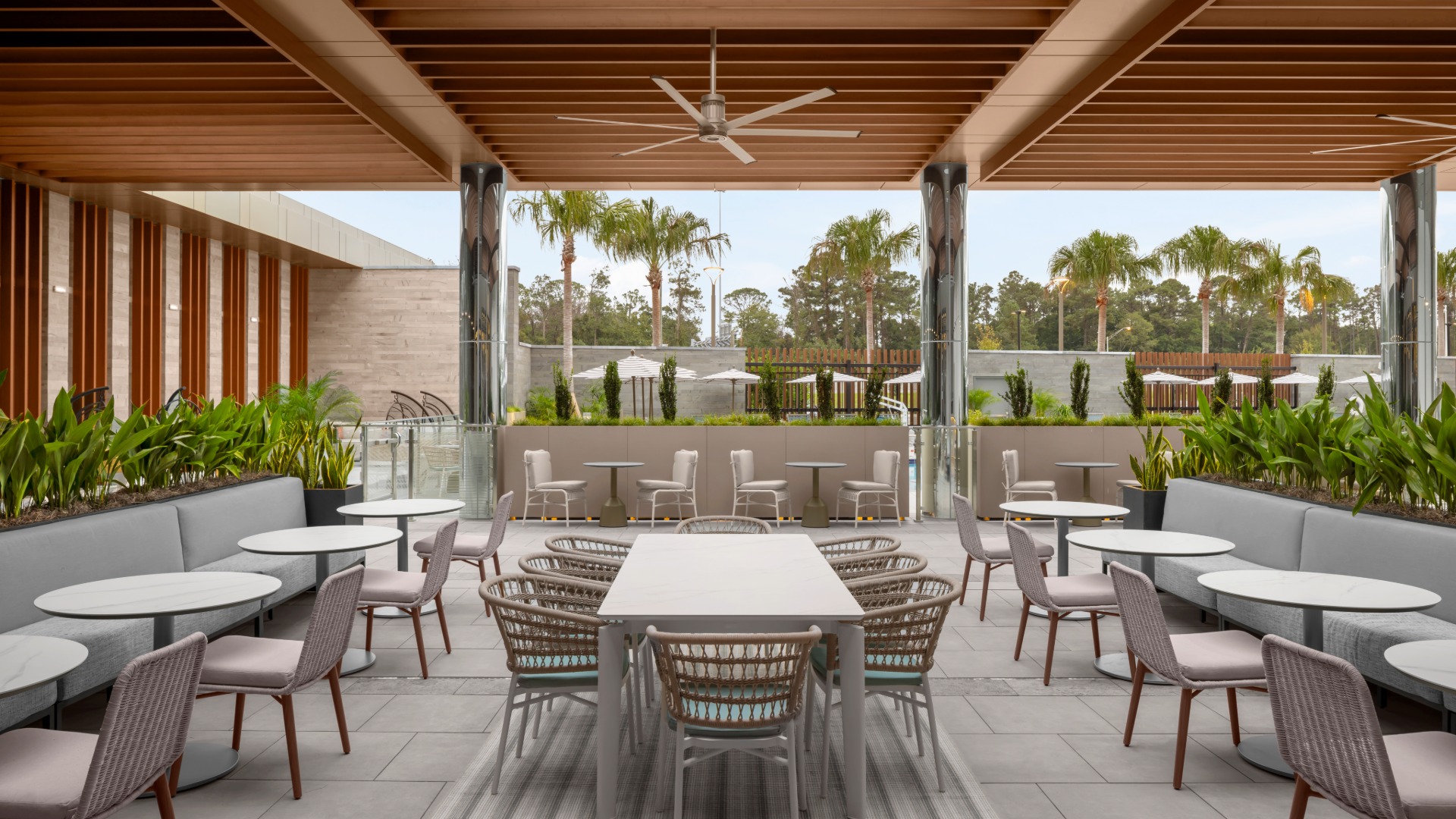 a patio with tables and chairs