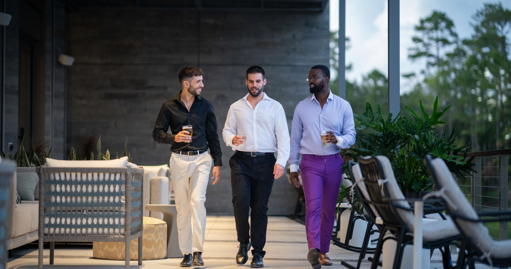 a group of men walking down a walkway