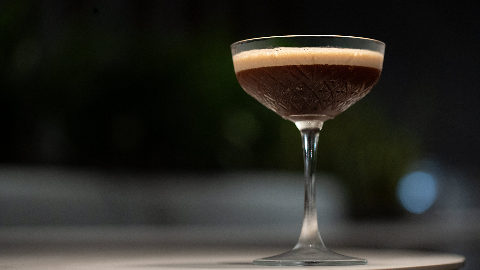 a glass with a brown liquid in it