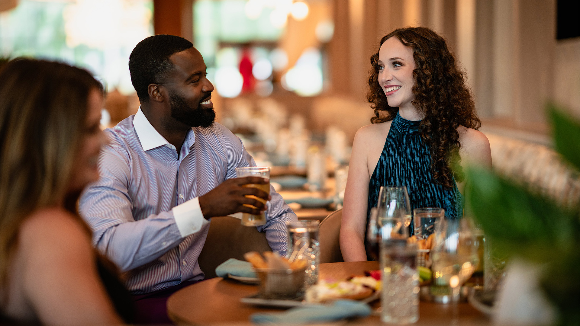 a man and woman sitting at a table