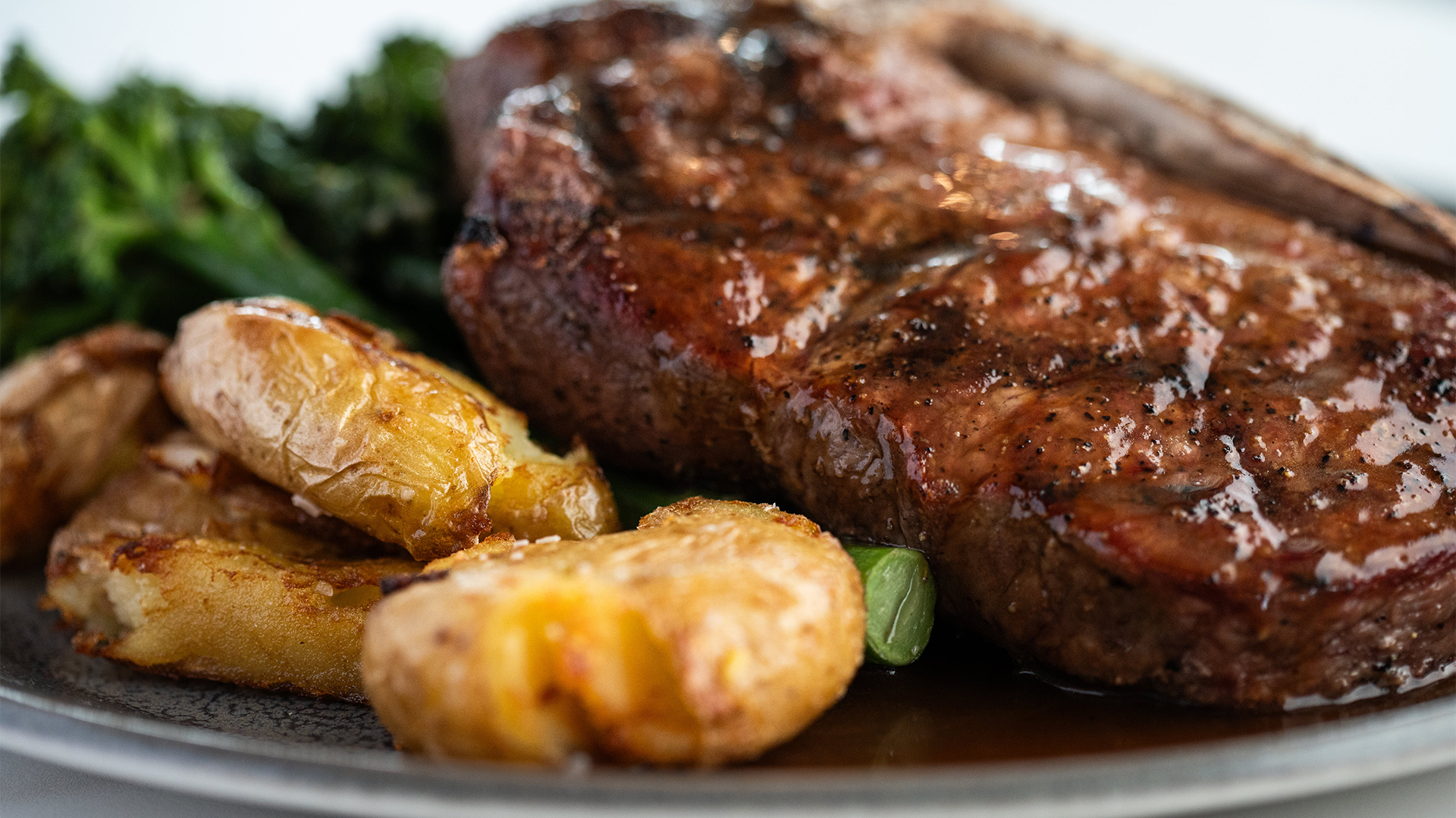 a plate of steak and potatoes