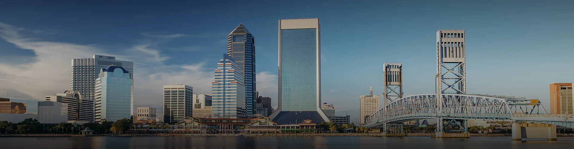 a large city skyline with a body of water
