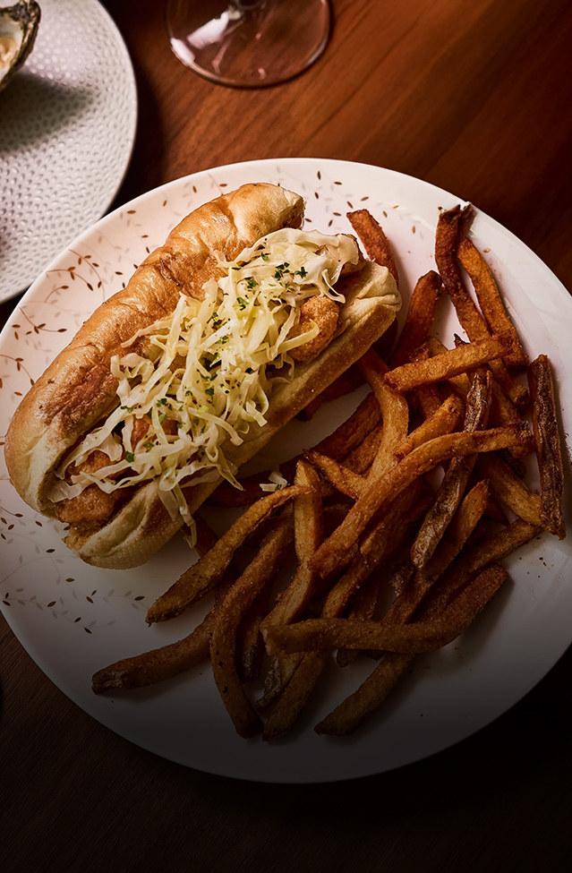 a hot dog and fries on a plate