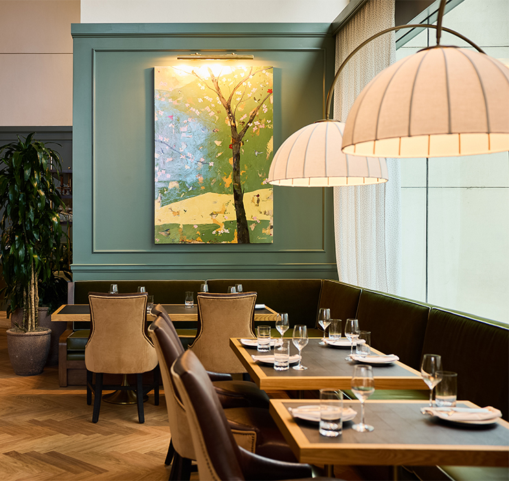 a table with empty plates and glasses in a restaurant