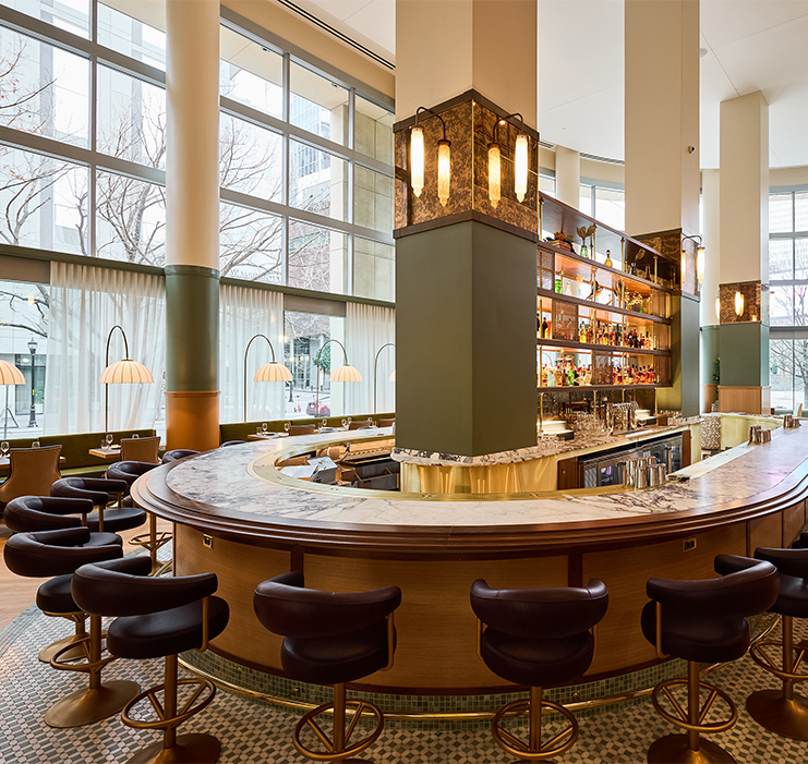 a bar with a counter and chairs