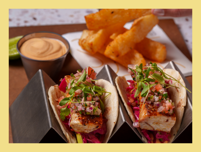 a tacos with sauce and fries