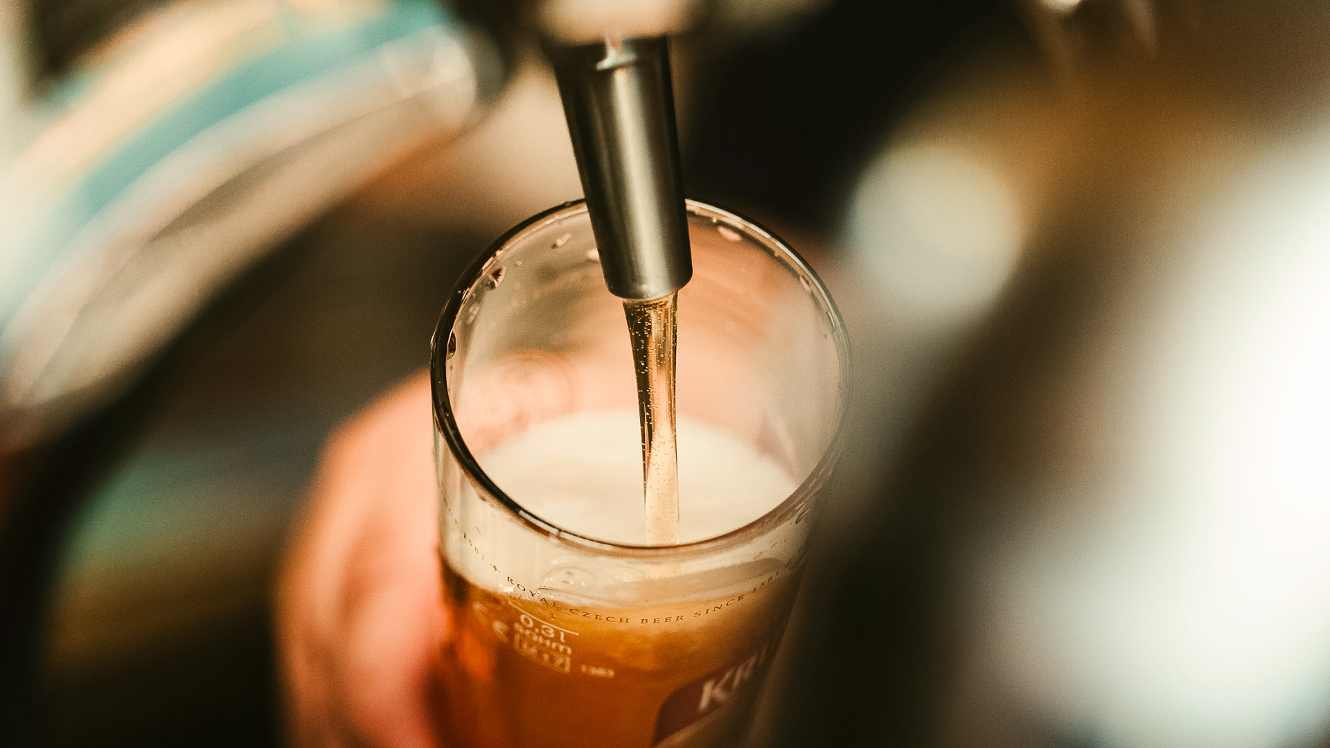 a beer being poured into a glass