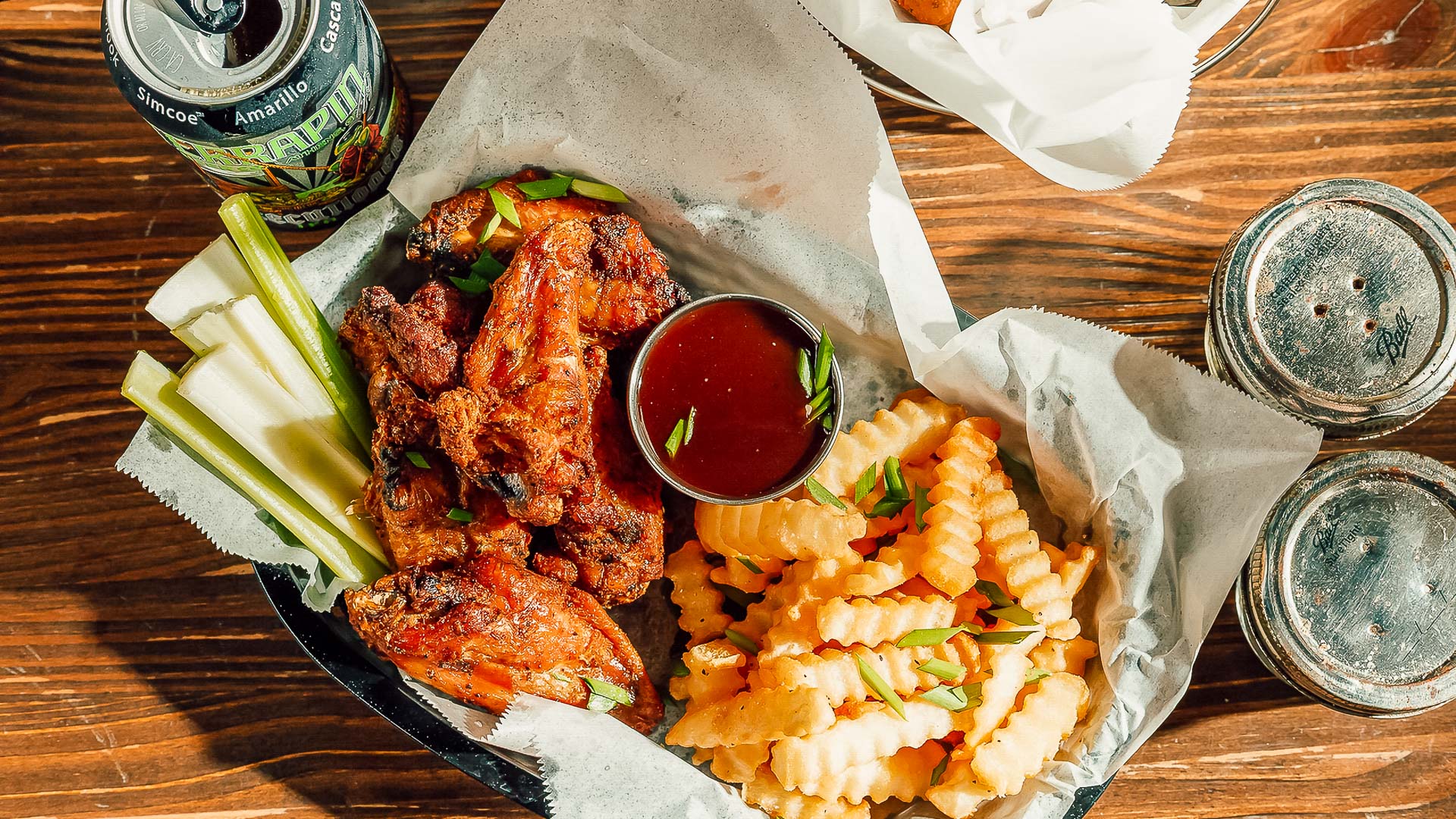 a plate of chicken wings and fries