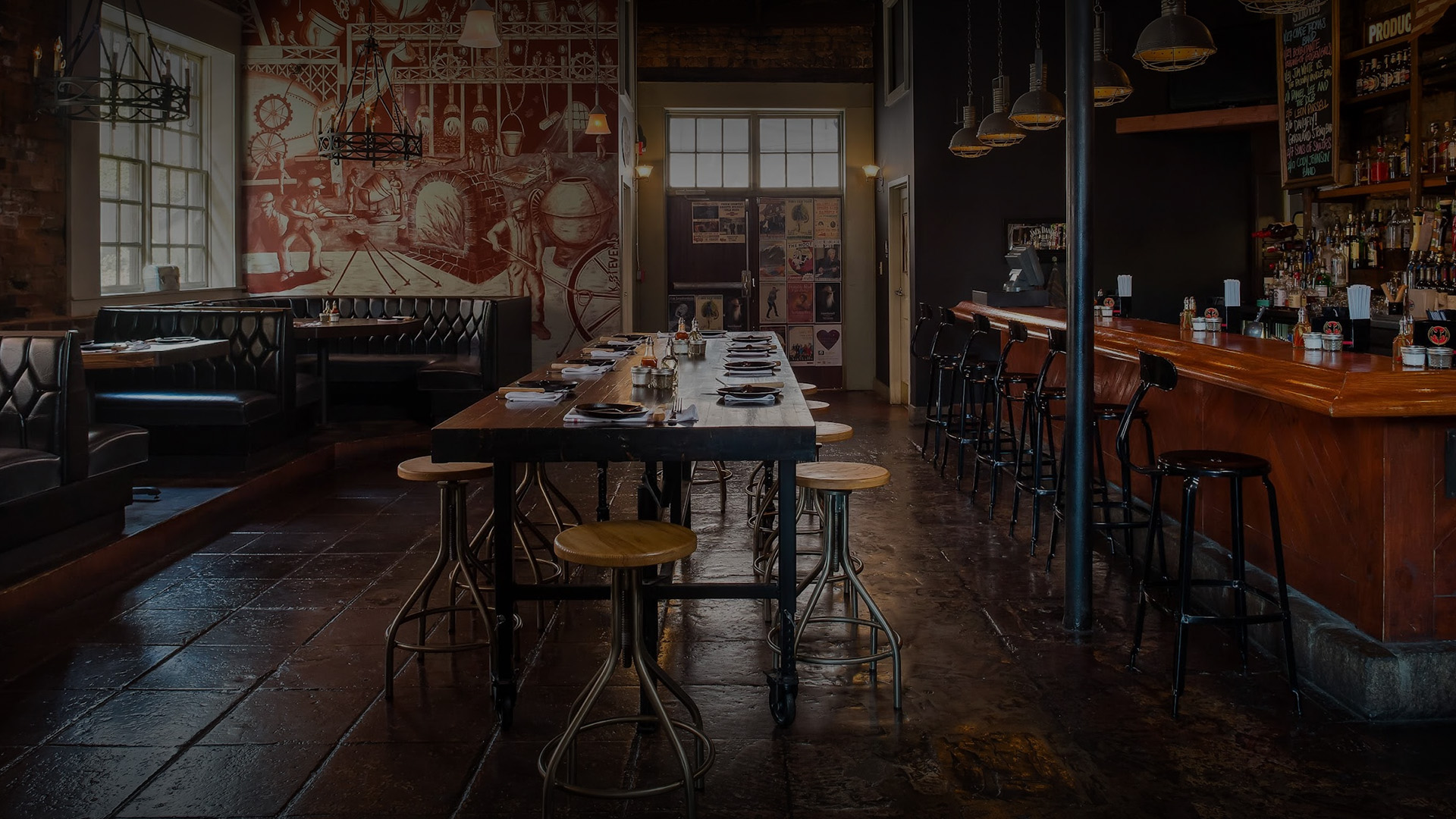 a long table with chairs and a bar