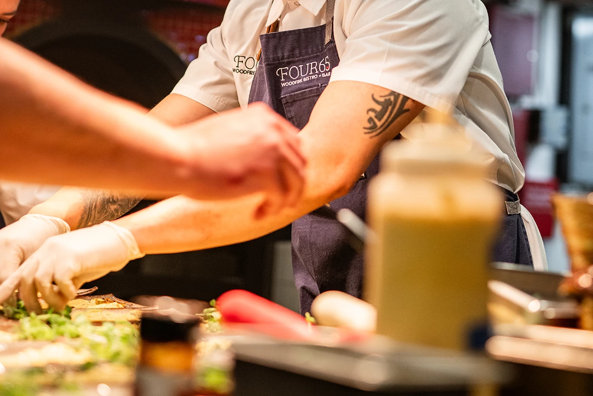 a person in a white shirt and apron