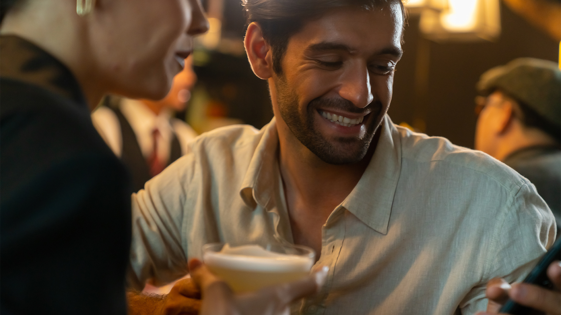 a man and woman smiling at each other