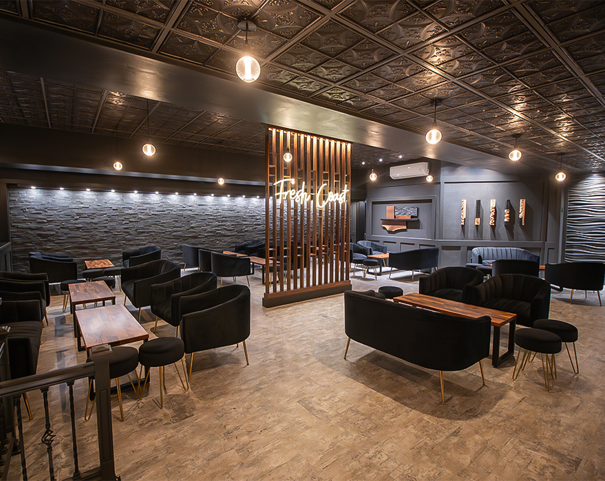 a room with black chairs and tables