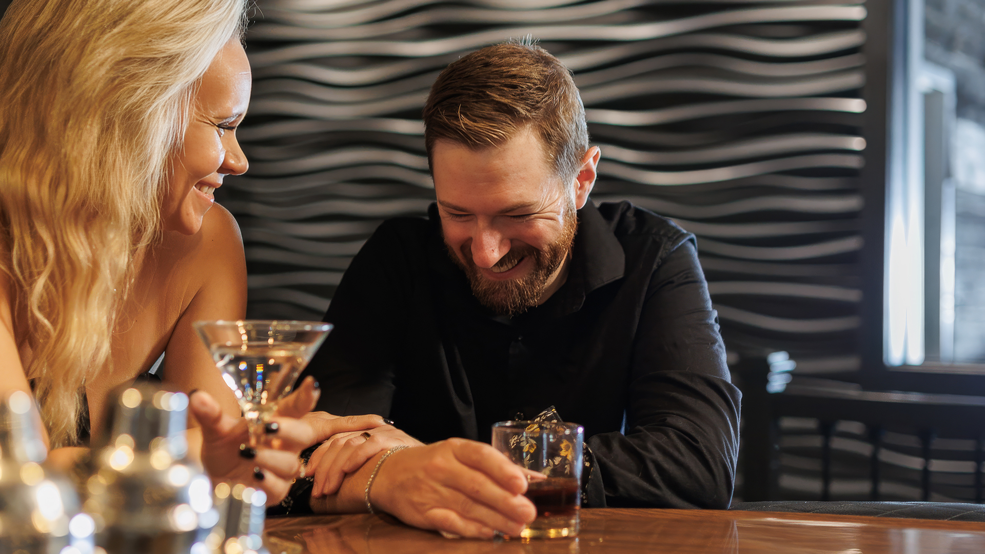 a man and woman smiling at each other